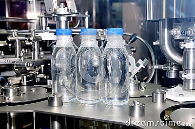 Industrial line for pouring of mineral water Stock Photo