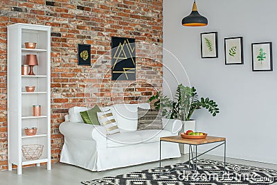 Industrial living room with couch Stock Photo