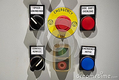 Industrial machine control panel with buttons and signals. center alarm button emergency, stop, side shift, overload, aktive Stock Photo