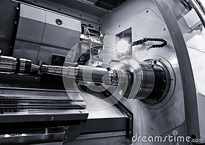 Industrial metal work bore machining process by cutting tool on automated lathe Stock Photo