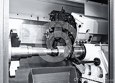 Industrial metal work bore machining process by cutting tool on automated lathe Stock Photo