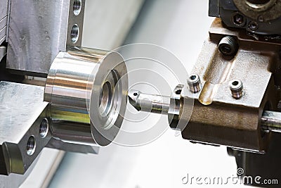 Industrial metal work machining process by cutting tool on CNC l Stock Photo