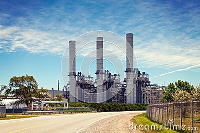 Industrial Petroleum Refinery Plant Smokestacks and Piping Stock Photo