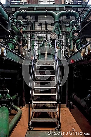 Industrial plant staircase. Machinery and Pipes. Editorial Stock Photo