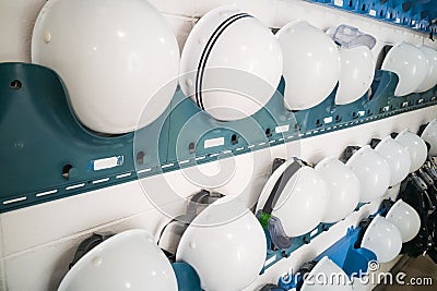 Industrial protection white safety helmet and goggles storage in Stock Photo