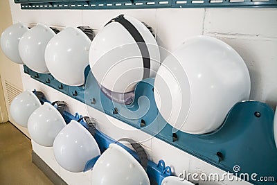 Industrial protection white safety helmet and goggles storage in Stock Photo