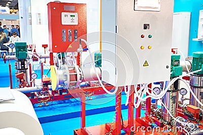 Industrial pumping units with control panels Stock Photo