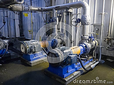 Industrial Pumps and Pipes Stock Photo