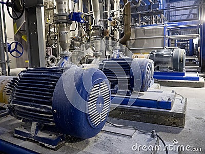 Industrial Pumps and Pipes Stock Photo