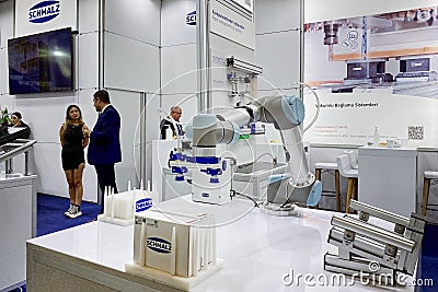 Industrial robot manipulator for many purposes products for furniture manufacturing at an exhibition Editorial Stock Photo