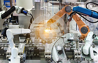 Industrial robot mechanical arm of Electronic Parts Manufacturing Stock Photo