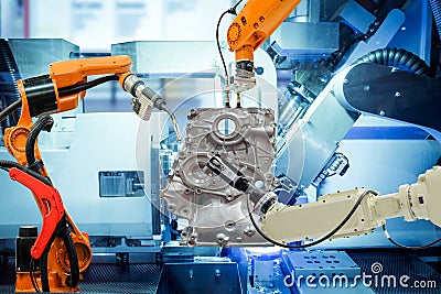 Industrial robotic teamwork working with auto parts on smart factory Stock Photo
