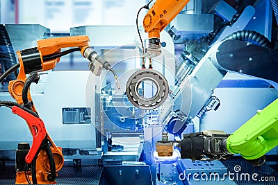 Industrial robotic welding and robot gripping working on smart factory Stock Photo