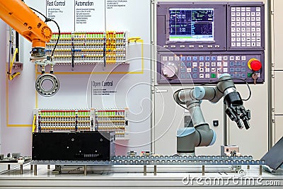Industrial robotics automation working via conveyor belt on smart factory, Stock Photo
