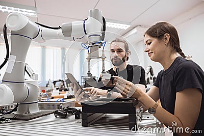 Industrial Robotics program university students learning education mechanical assembly with Robot Universal Training Platform Stock Photo