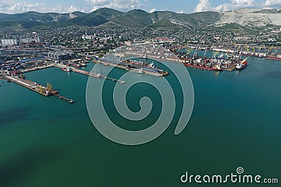Industrial seaport, top view. Port cranes and cargo ships and barges Stock Photo