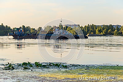 Industrial ship on the Dnieper river in Kremenchug, Ukraine Editorial Stock Photo