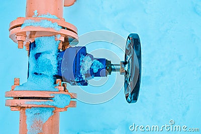 Industrial shut-off regulating protective pipe fittings Black valve for opening, closing on an iron orange metal pipe with flanges Stock Photo