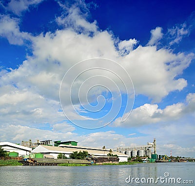 Industrial Silo Warehouse beside Tha Chin River Stock Photo