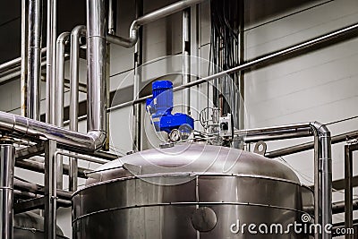 Industrial stainless steel tank in modern brewery Stock Photo