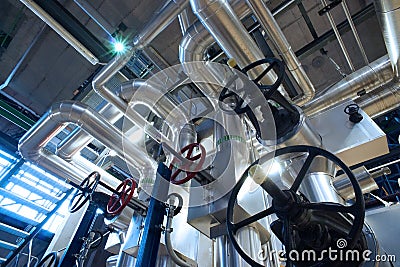 Industrial Steel pipelines, valves, cables and walkways Stock Photo