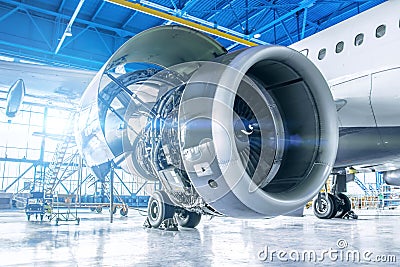 Industrial theme view. Repair and maintenance of aircraft engine on the wing of the aircraft Stock Photo