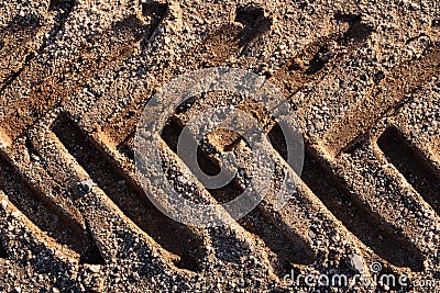 Industrial Tractor Footprint on Desert Sand Stock Photo