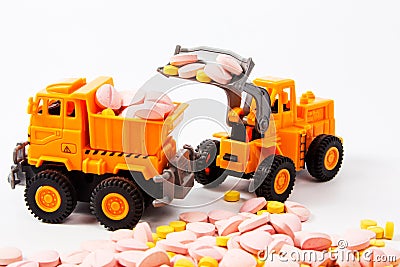 Industrial tractor toy load Pill Stock Photo