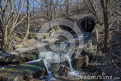 Industrial urban sewage wastewater drains from concrete pipes Stock Photo