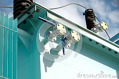 Industrial valves on a turquoise painted equipment. Stock Photo