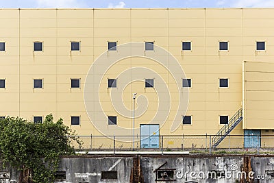 Industrial Wall With Seagull Sitting On Top of Light Poll Stock Photo