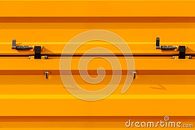 Industrial wavy orange tinware with metal elements Stock Photo