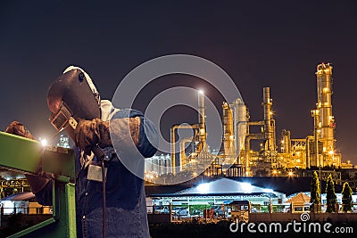 Industrial welding worker at the petrochemical plant Stock Photo