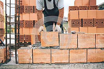 worker, construction worker using modern bricks for brickwork, building walls Stock Photo