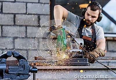 Industrial worker cutting metal Stock Photo