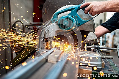 Industrial worker using a compound mitre saw with circular blade Stock Photo