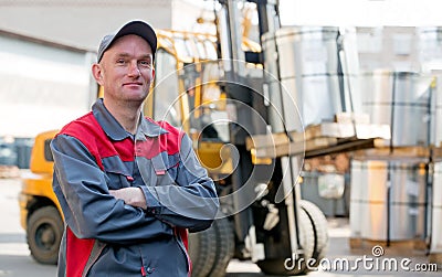 Portrait industrial worker on warehouse forklift truck background Stock Photo