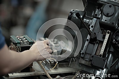 Industrial worker is working on metal work factory process Stock Photo