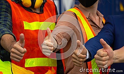 Industrial workers or engineers Thumbs up Stock Photo