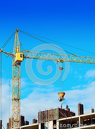 Industrial yellow crane building house background Editorial Stock Photo