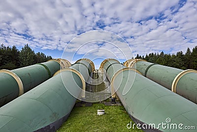 Industrial zone, Steel pipelines and valves against blue sky Stock Photo