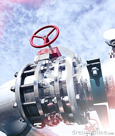 Industrial Steel pipelines and valves against blue sky Stock Photo