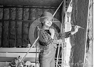 Industry. kid in workshop training to use hand instrument. girl wearing engineer clothes. Tools to improve yourself Stock Photo