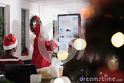 Industry leader dressed as Santa Claus Stock Photo