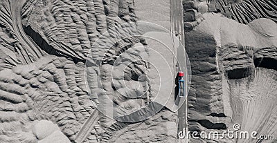 Industry mining top view, truck dump loaded with rubble rides through open mine Stock Photo