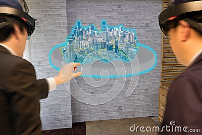 Industry smart city technology concept, civil engineer,architect blurred use augmented mixed virtual reality technology to see Stock Photo