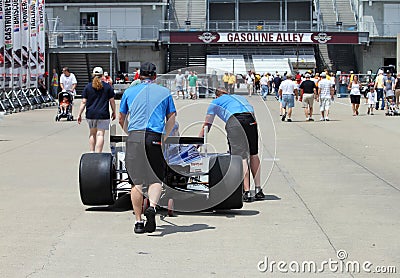 Indy 500 Race Crew Members pushing a Race Car to Gasoline Alley Editorial Stock Photo