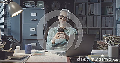 Inefficient office worker chatting with her phone Stock Photo