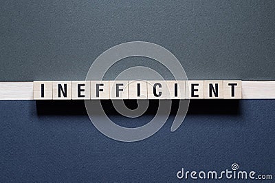 Inefficient word concept on cubes Stock Photo