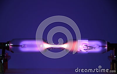 The inert gas Helium He seen in a discharge tube Stock Photo